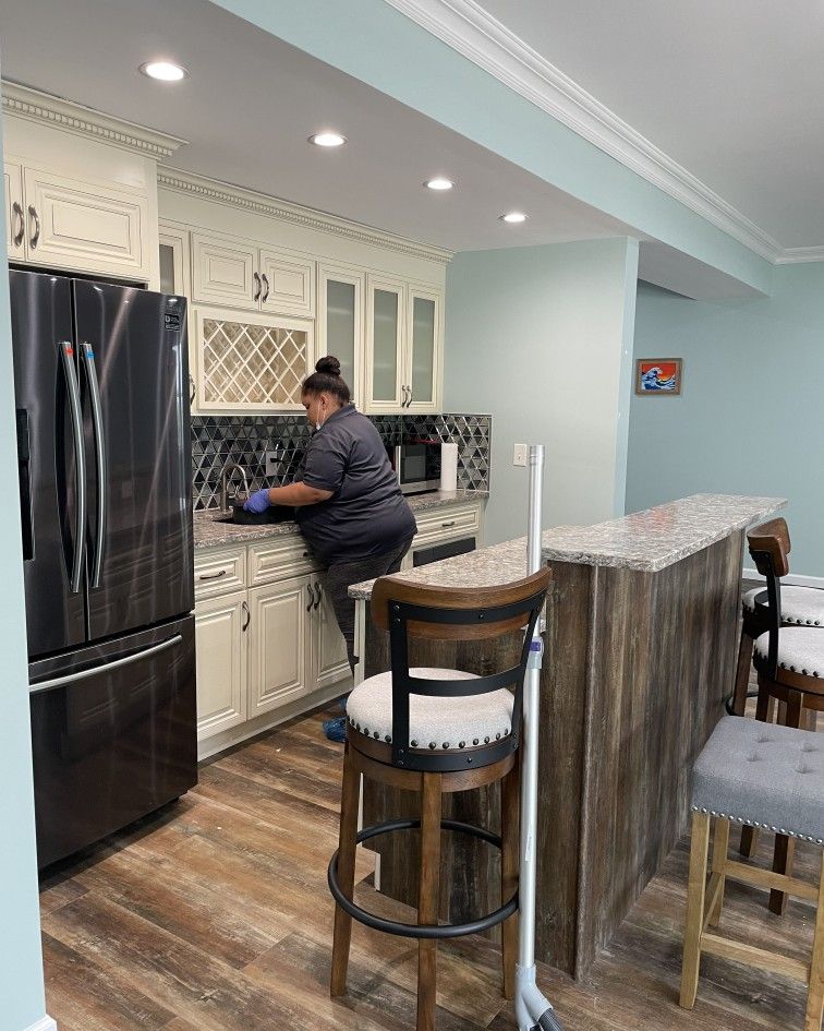 Cleaner working in a clean kitchen